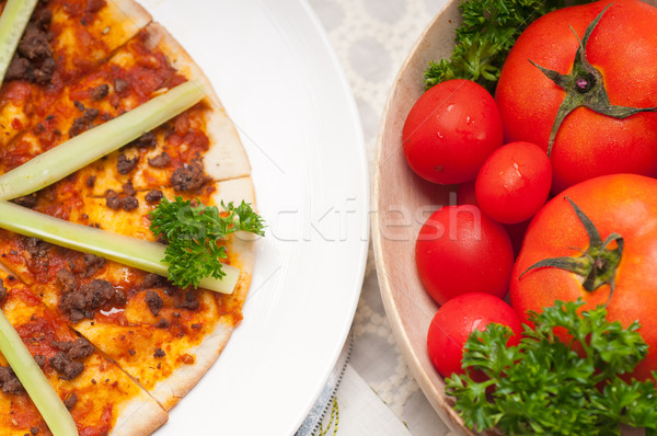 Turkish beef pizza with cucumber on top Stock photo © keko64