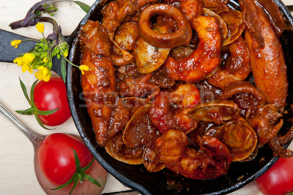 fresh seafoos stew on an iron skillet Stock photo © keko64