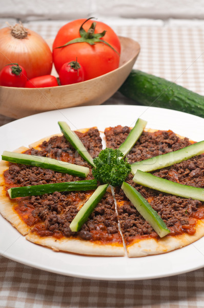 Turkish beef pizza with cucumber on top Stock photo © keko64