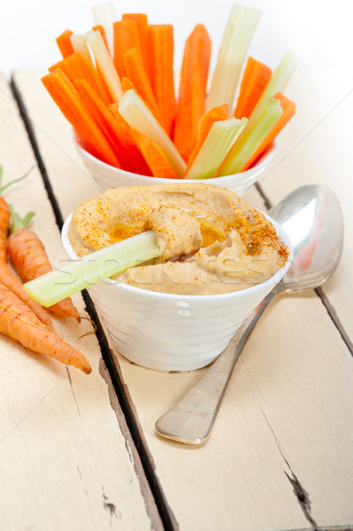 fresh hummus dip with raw carrot and celery  Stock photo © keko64
