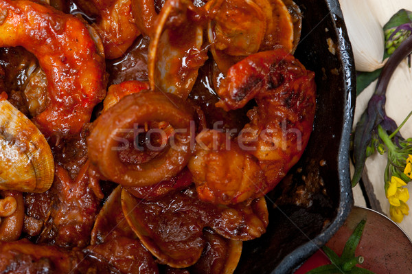 fresh seafoos stew on an iron skillet Stock photo © keko64