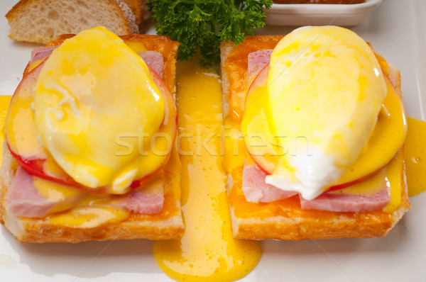 eggs benedict on bread with tomato and ham Stock photo © keko64