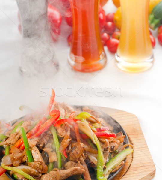 Stock photo: original fajita sizzling hot  on iron plate