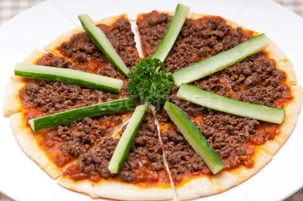 Turkish beef pizza with cucumber on top Stock photo © keko64