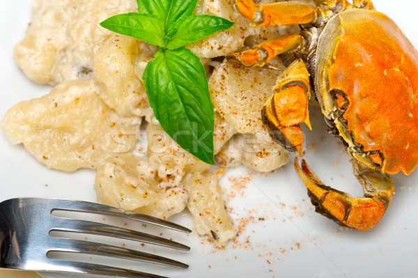 Stock photo: Italian gnocchi with seafood sauce with crab and basil