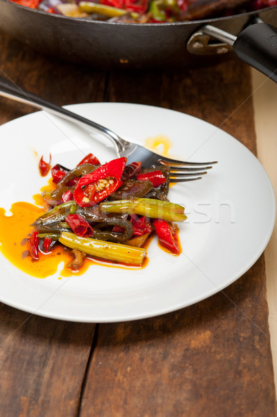 Stock photo: fried chili pepper and vegetable on a wok pan