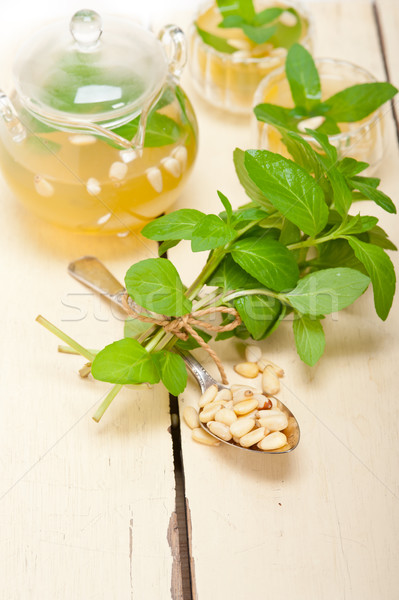 Arab traditional mint and pine nuts tea Stock photo © keko64