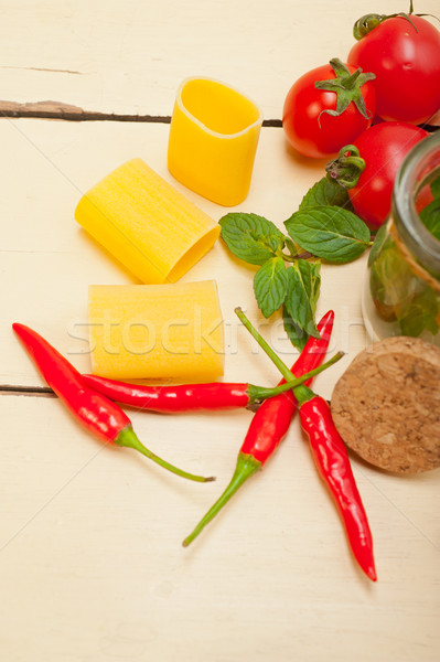 Italian pasta paccheri with tomato mint and chili pepper Stock photo © keko64