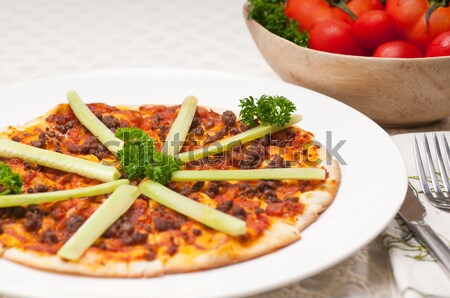 Turkish beef pizza with cucumber on top Stock photo © keko64