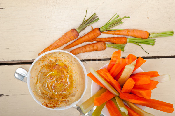 fresh hummus dip with raw carrot and celery  Stock photo © keko64