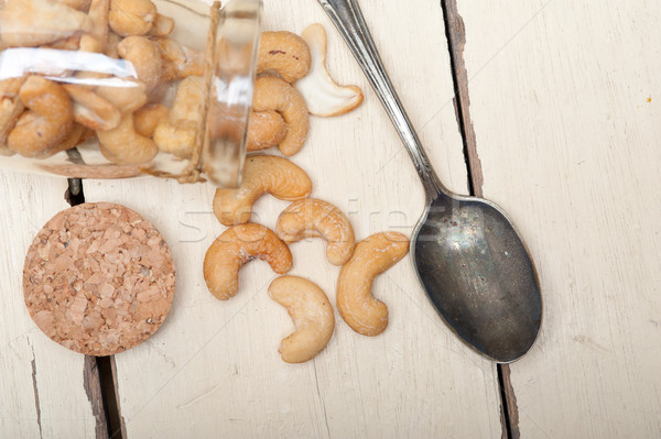 Foto stock: Anacardo · nueces · vidrio · jar · blanco · rústico