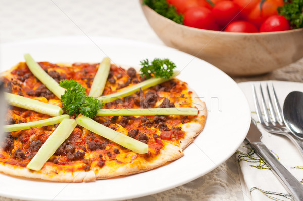 Turkish beef pizza with cucumber on top Stock photo © keko64