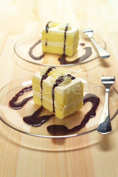 Stock photo: fresh cream cake closeup with chocolate sauce