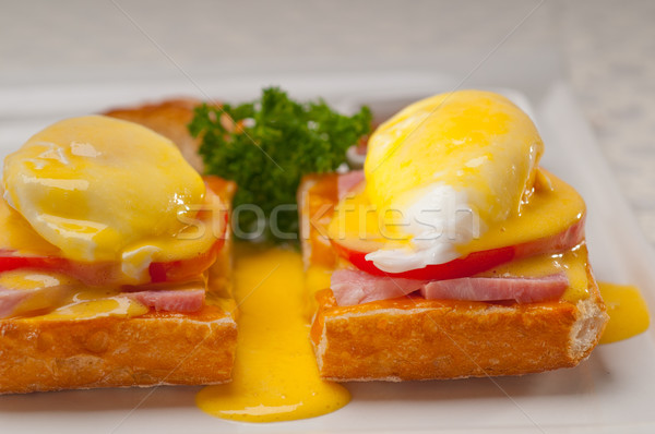 eggs benedict on bread with tomato and ham Stock photo © keko64