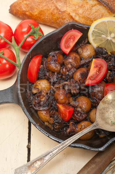 Baby cuttle fish roasted on iron skillet Stock photo © keko64
