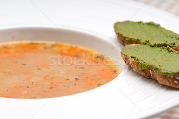 Stock photo: Italian minestrone soup with pesto crostini on side