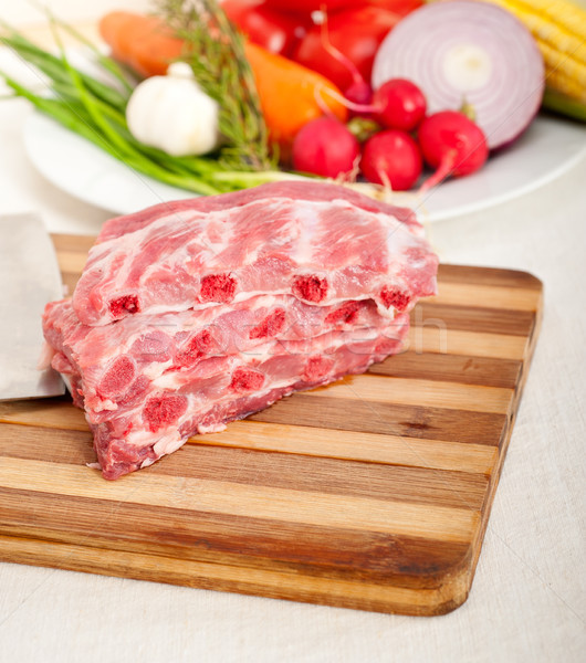 chopping fresh pork ribs and vegetables Stock photo © keko64