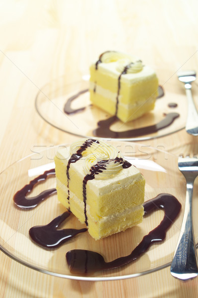 Stock photo: fresh cream cake closeup with chocolate sauce
