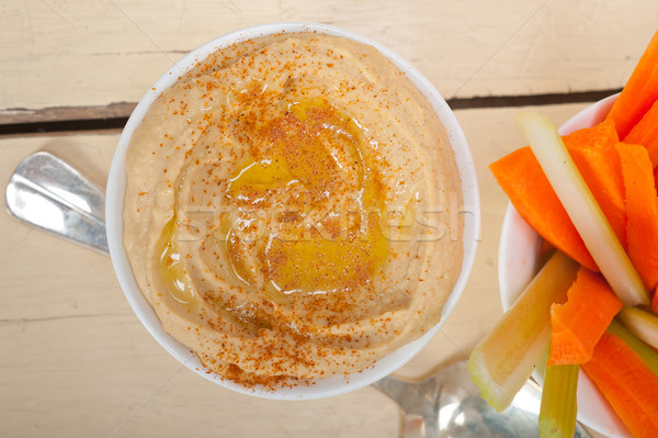 fresh hummus dip with raw carrot and celery  Stock photo © keko64