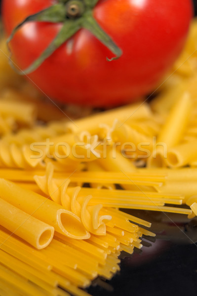 Italian pasta selection and tomato over black Stock photo © keko64