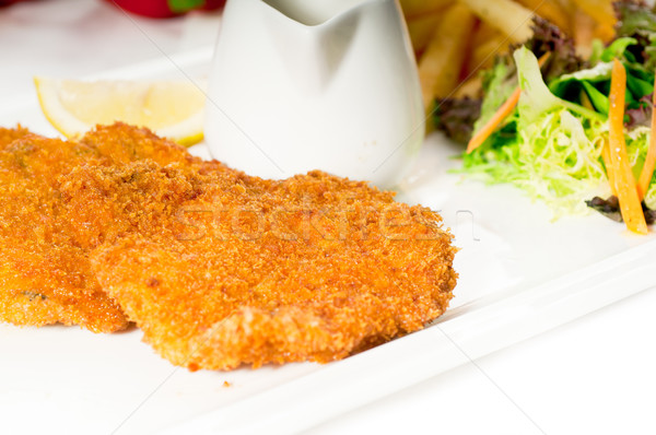 classic Milanese veal cutlets and vegetables Stock photo © keko64