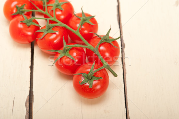 fresh cherry tomatoes on a cluster Stock photo © keko64