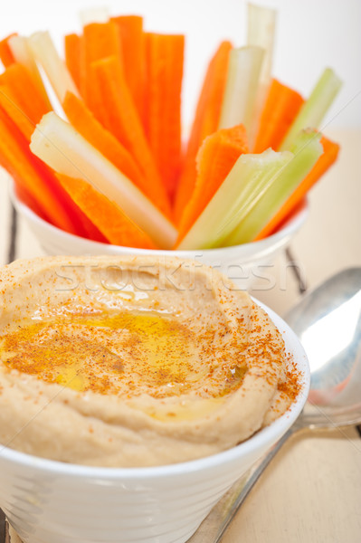 fresh hummus dip with raw carrot and celery  Stock photo © keko64