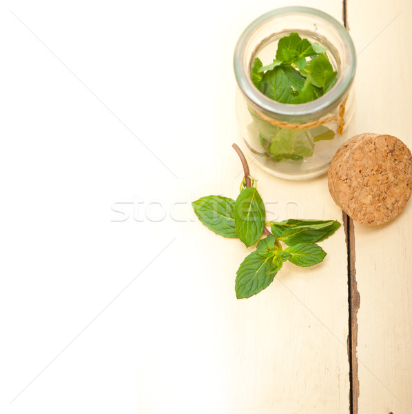fresh mint leaves on a glass jar Stock photo © keko64