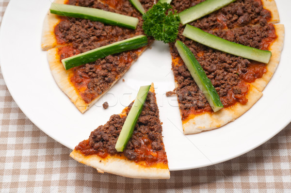 Turkish beef pizza with cucumber on top Stock photo © keko64