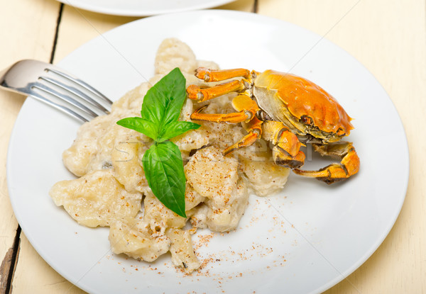 Stock photo: Italian gnocchi with seafood sauce with crab and basil