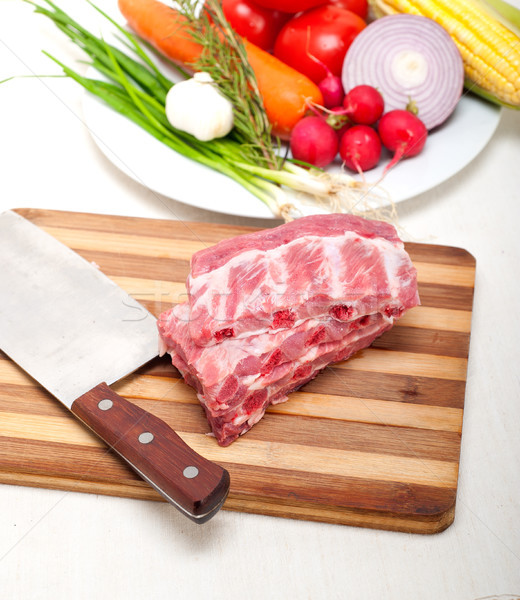 chopping fresh pork ribs and vegetables Stock photo © keko64