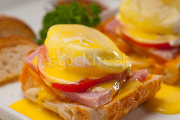 eggs benedict on bread with tomato and ham Stock photo © keko64