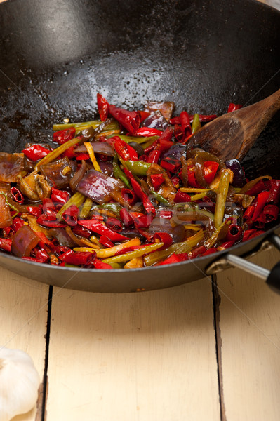 fried chili pepper and vegetable on a wok pan Stock photo © keko64