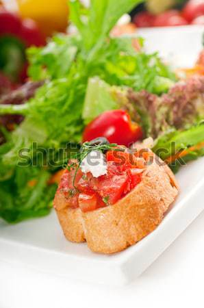 Eredeti olasz friss bruschetta felszolgált saláta Stock fotó © keko64