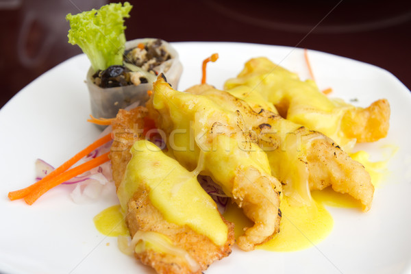 Stock photo: Baked fish fillets with cheese sauce
