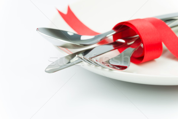 Fork, spoon and knife tied up with red ribbon Stock photo © kenishirotie