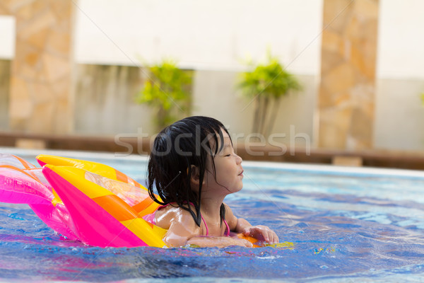 Child swimming Stock photo © kenishirotie