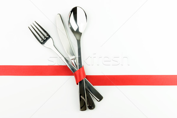 Fork, knife and spoon tied up with red ribbon Stock photo © kenishirotie
