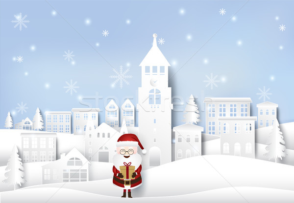 Happy winter with santa holding gift box in city town paper art  Stock photo © Kheat