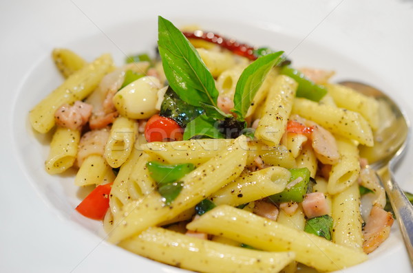 Penne pasta with ham and basil, Italian food. Stock photo © Kheat