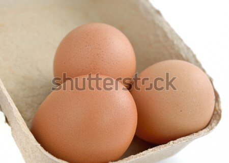 Fresh eggs with a carton box Stock photo © Kheat