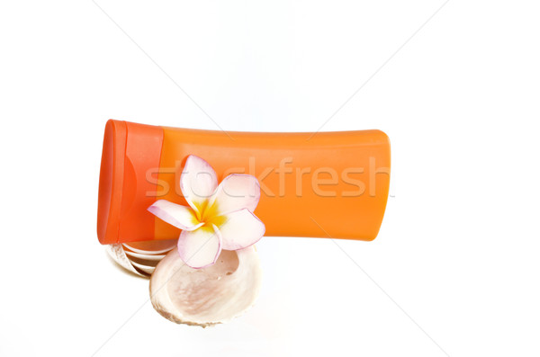 sunblock with flower and shells Stock photo © Kheat