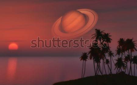 Palm tree island against a sunset sky with the planet Saturn Stock photo © kjpargeter