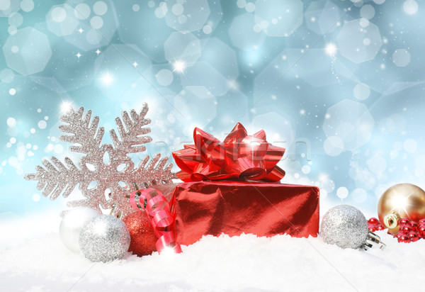 Christmas decorations on blue glittery background Stock photo © kjpargeter