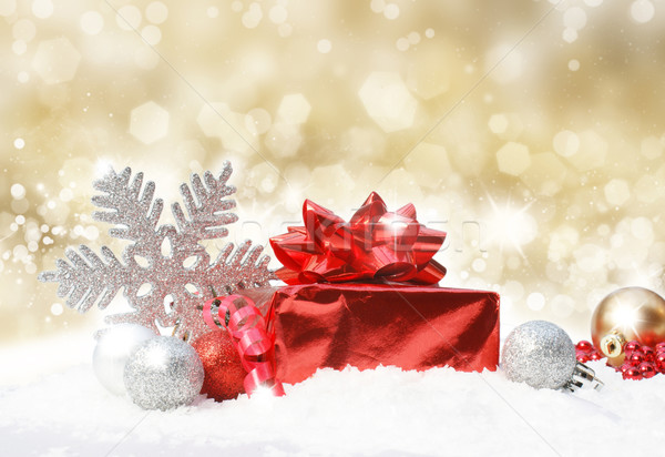 Christmas decorations on gold glittery background Stock photo © kjpargeter