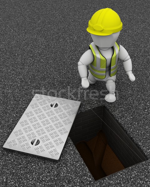 Builder inspecting drains through manhole cover Stock photo © kjpargeter