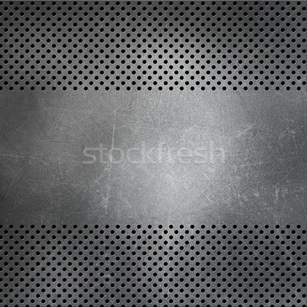 Stock photo: Scratched perforated metal background 