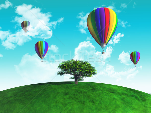 Hot air balloons with tree on grassy globe Stock photo © kjpargeter