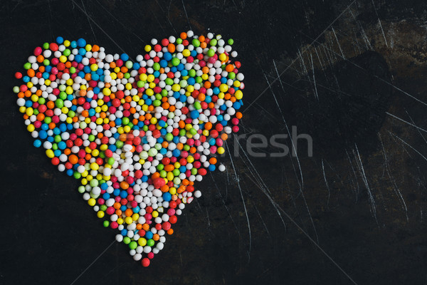 Colorful Sugar Balls in the form of heart. Stock photo © kkolosov