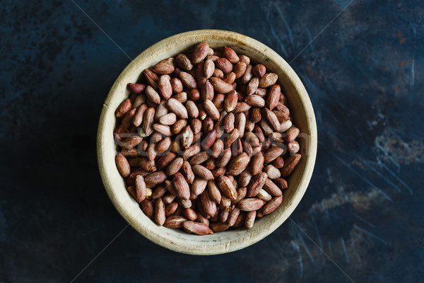 Cacahuètes bois bol sombre haut [[stock_photo]] © kkolosov